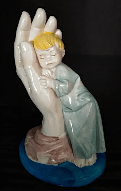 In the hands sale of god Figurine